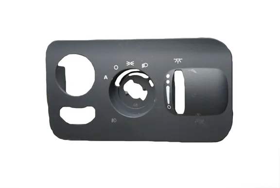 Headlamp control bezel with etched symbols